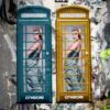 Two ladies in two phoneboxes
