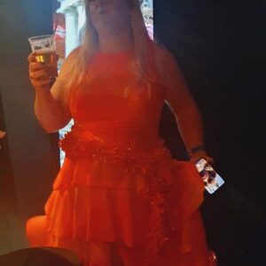 Mikki in an orange dress
